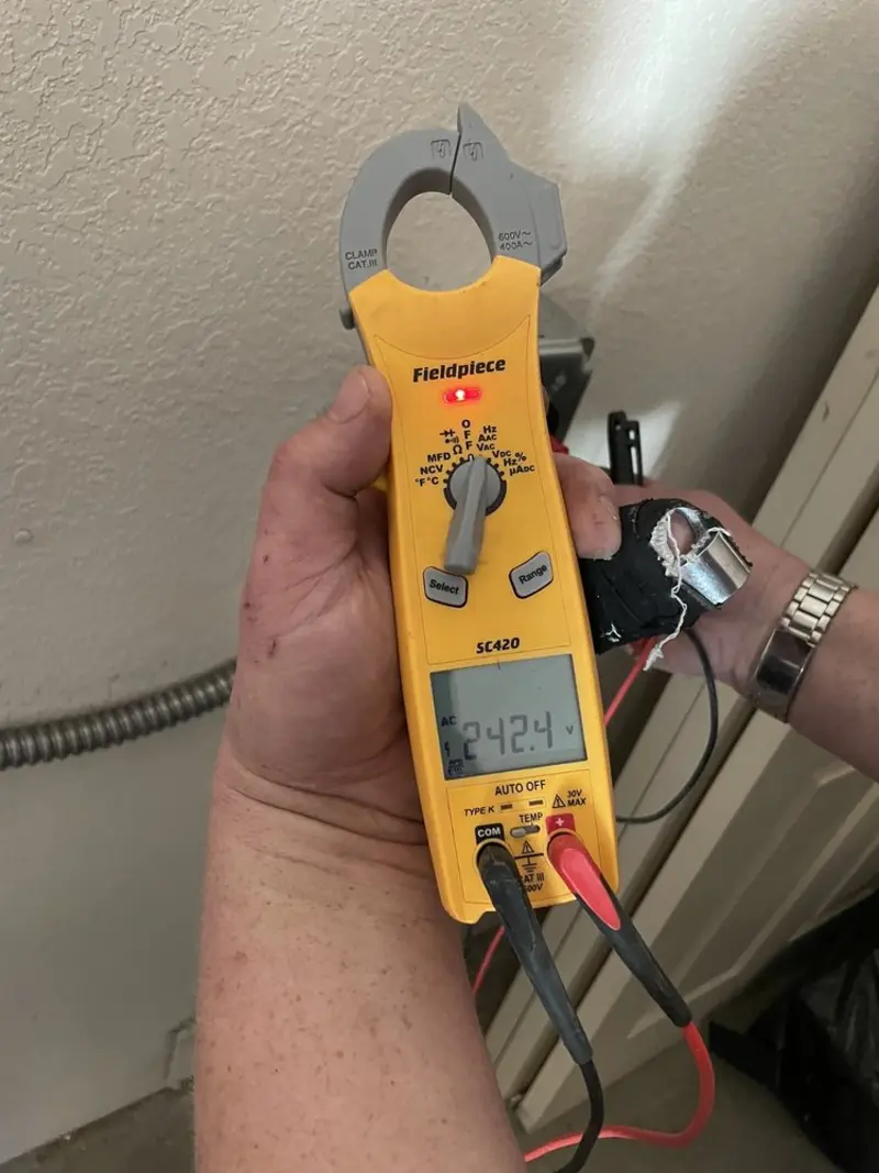 Voltage testing with clamp meter during Whole House Surge Protector in Argyle